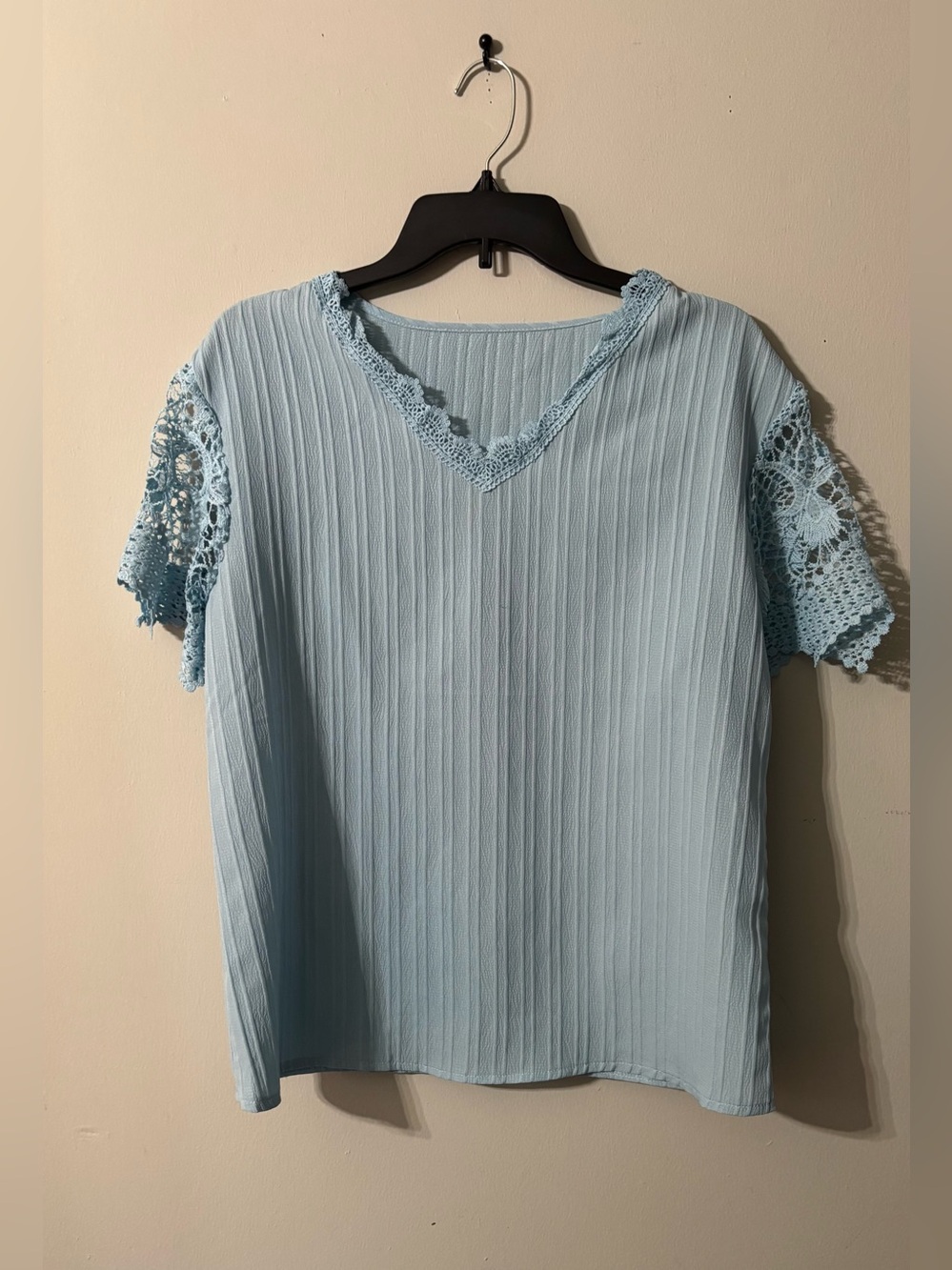 Large baby blue blouse with crochet sleeves